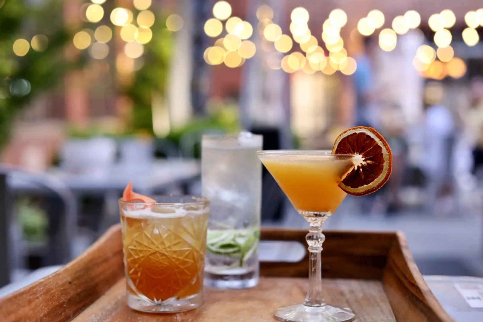 Three cocktails presented in the Elsewhere courtyard