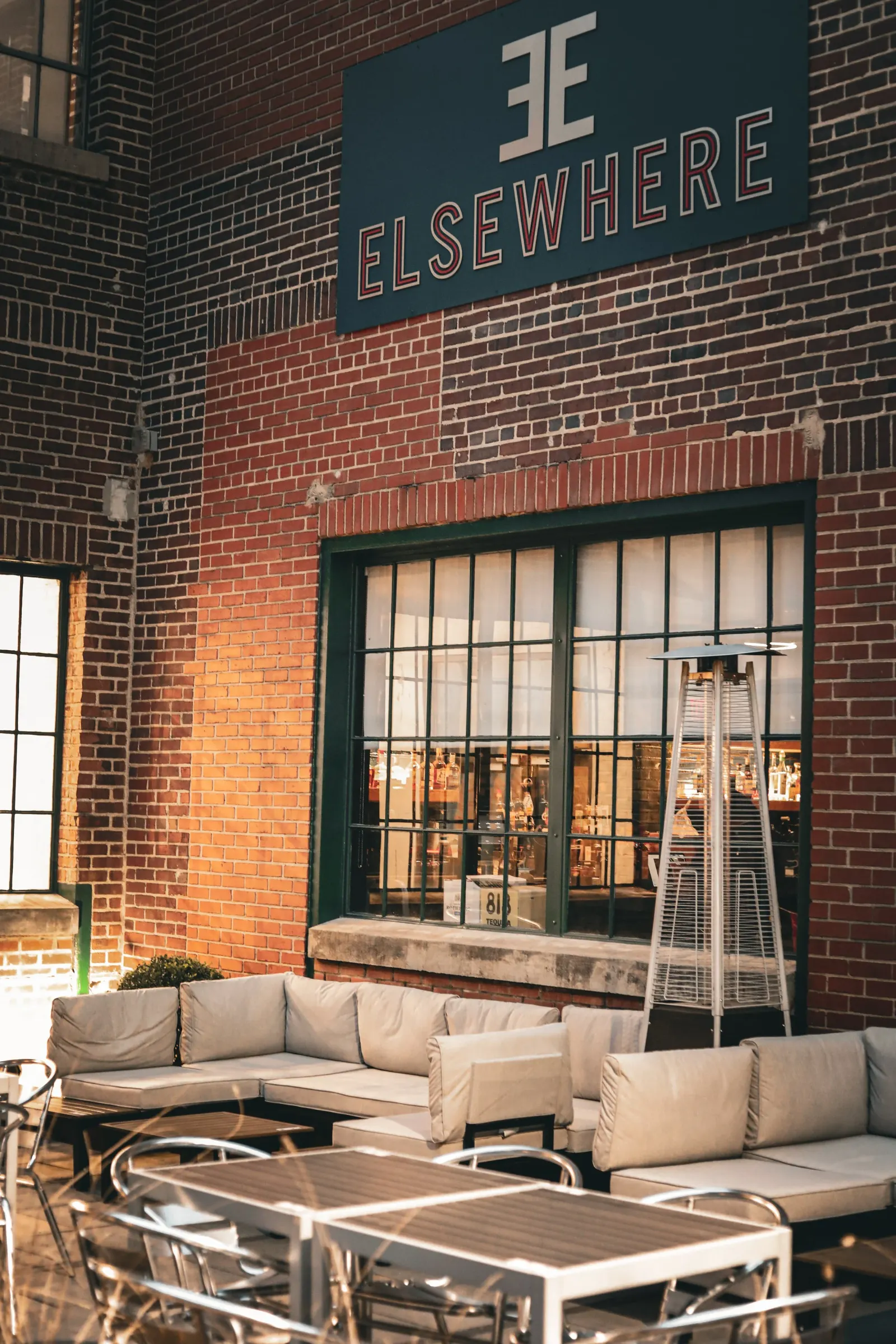 Outdoor lounge and brick entrance at Elsewhere
